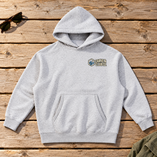Aprés Department Hoodie — front view flat lay on wood tabletop