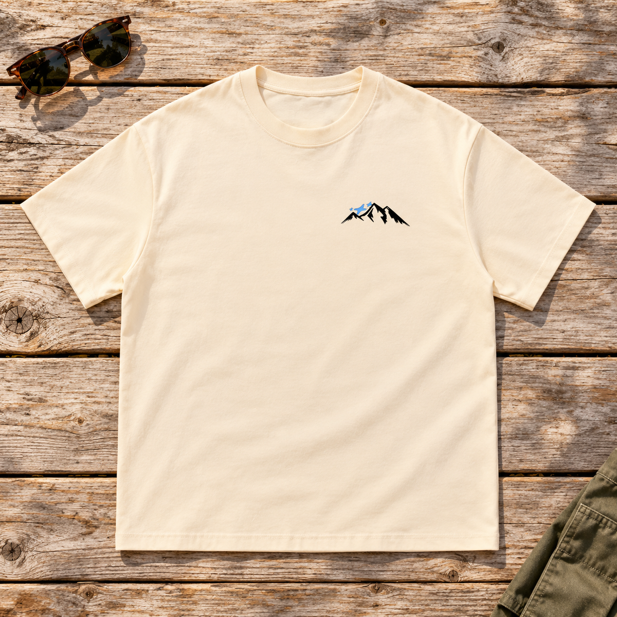 Last Lift Ticket Tee — front view flat lay on wood tabletop