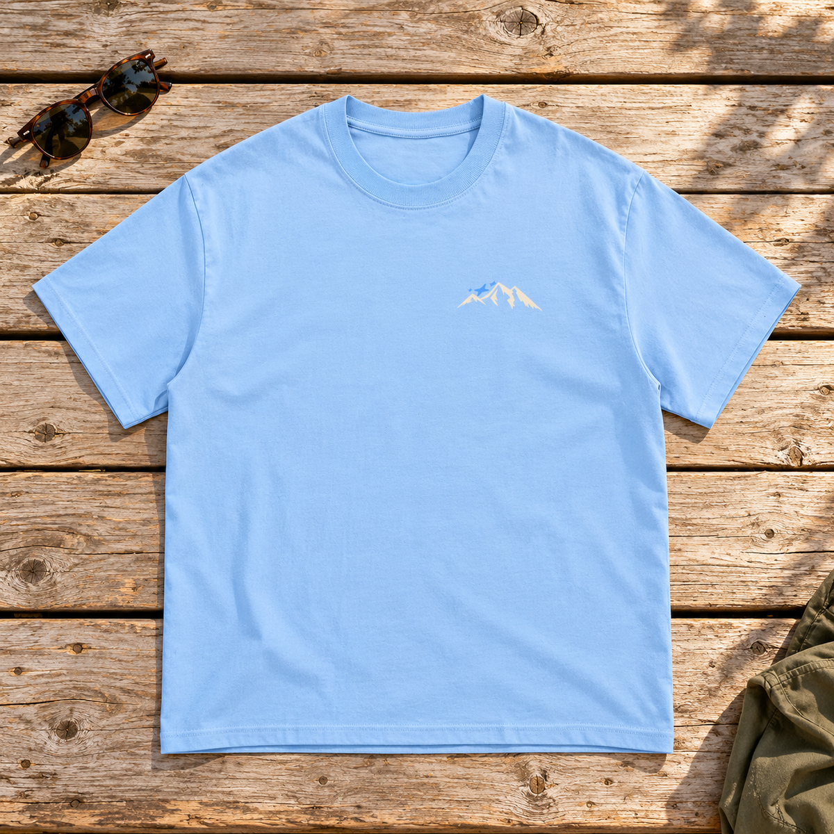 Last Lift Ticket Tee — front view flat lay on wood tabletop