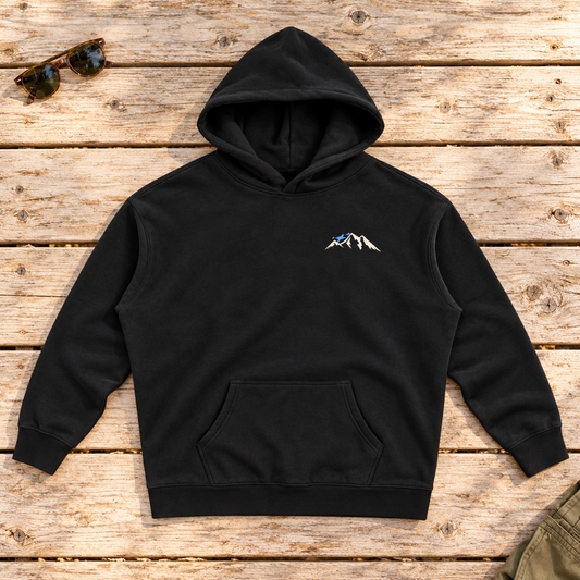 Last Lift Social Club Hoodie — front view flat lay on wood tabletop