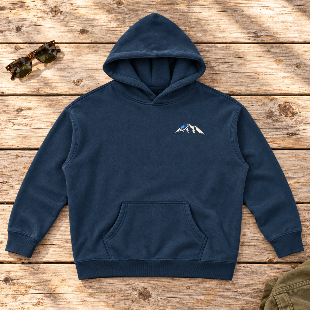 Last Lift Social Club Hoodie — front view flat lay on wood tabletop