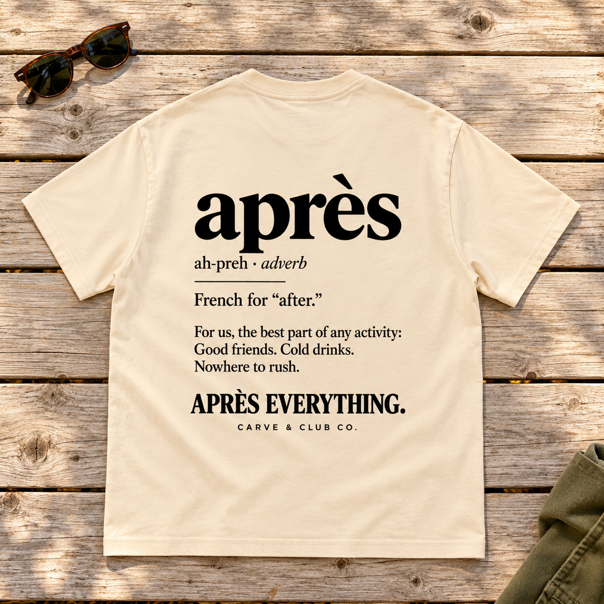 The Après Definition Tee — back view flat lay on wood tabletop