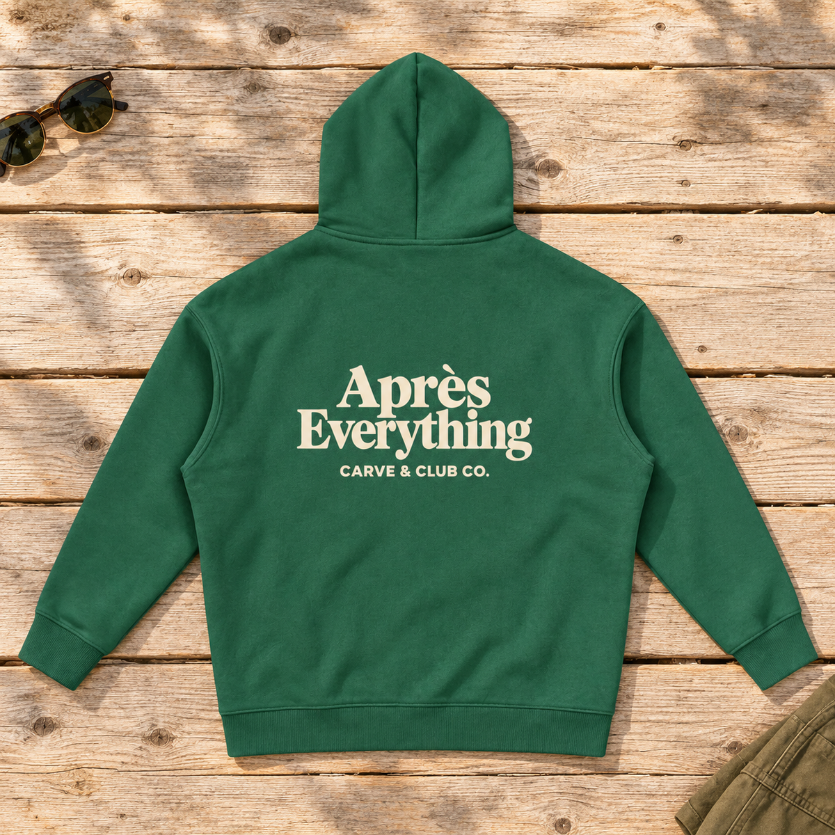 Après Everything Signature Hoodie — back view flat lay on wood tabletop