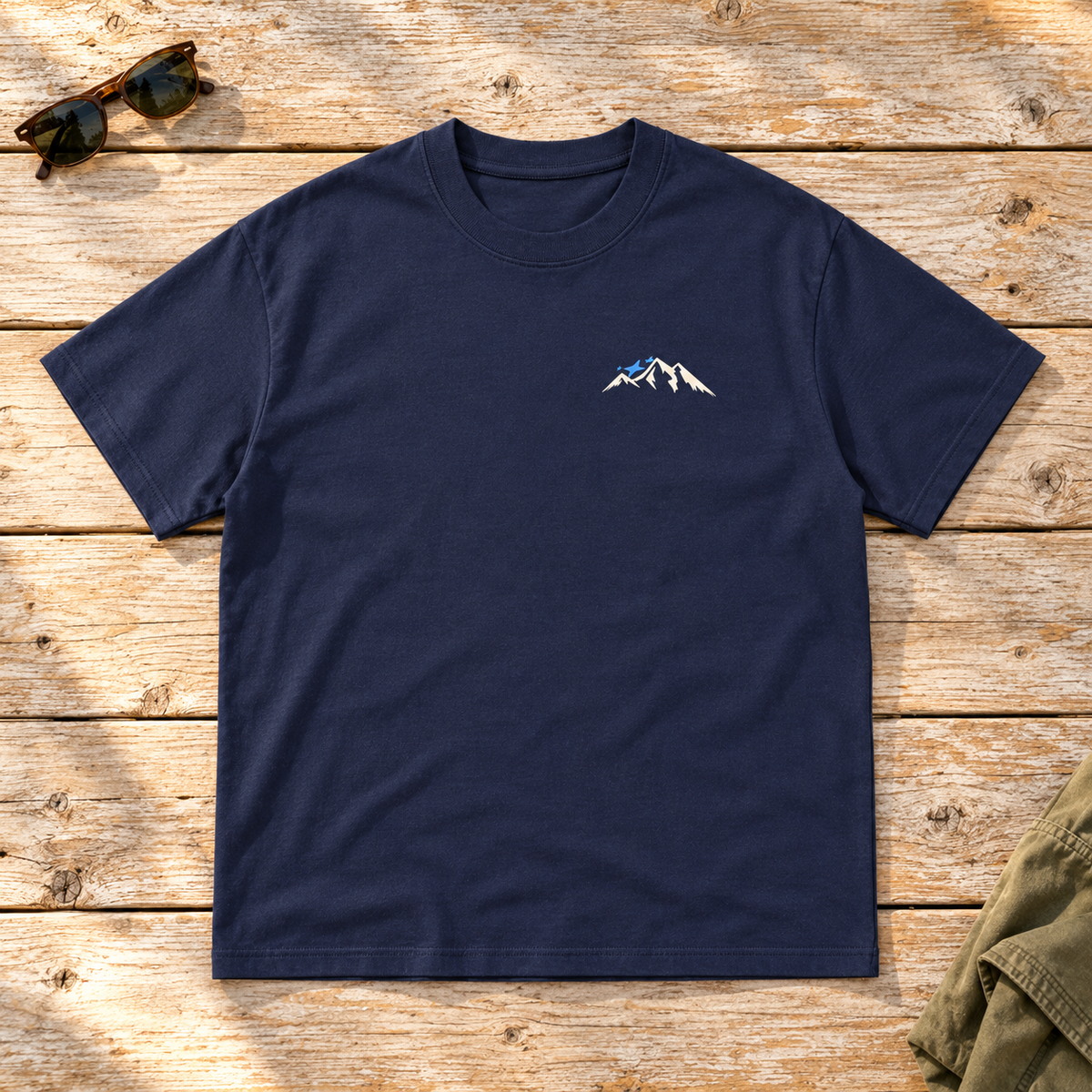 Last Lift Ticket Tee — front view flat lay on wood tabletop
