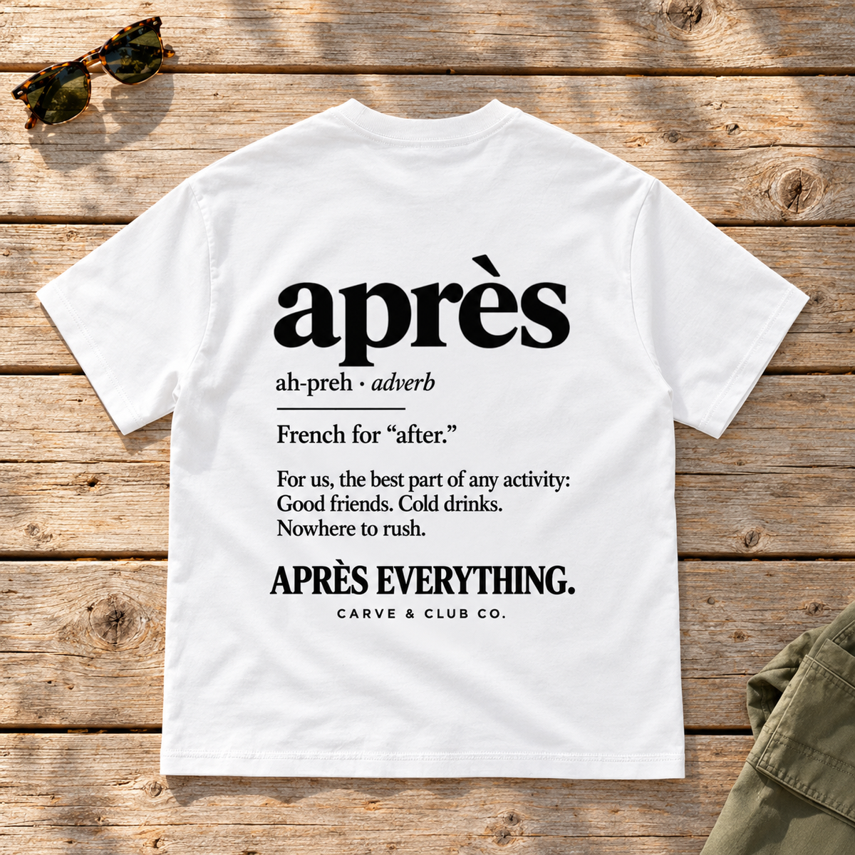 The Après Definition Tee — back view flat lay on wood tabletop