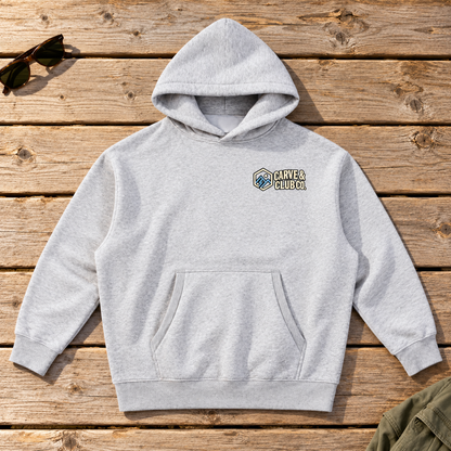 Aprés Department Hoodie — front view flat lay on wood tabletop
