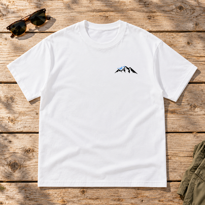 Last Lift Ticket Tee — front view flat lay on wood tabletop