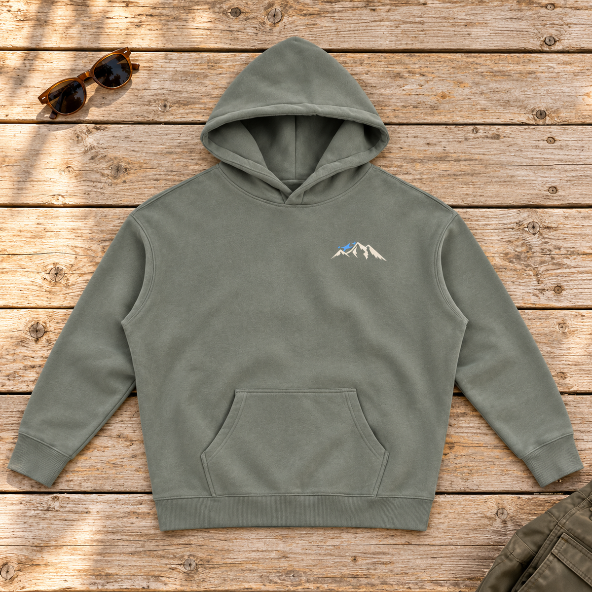 Last Lift Social Club Hoodie — front view flat lay on wood tabletop