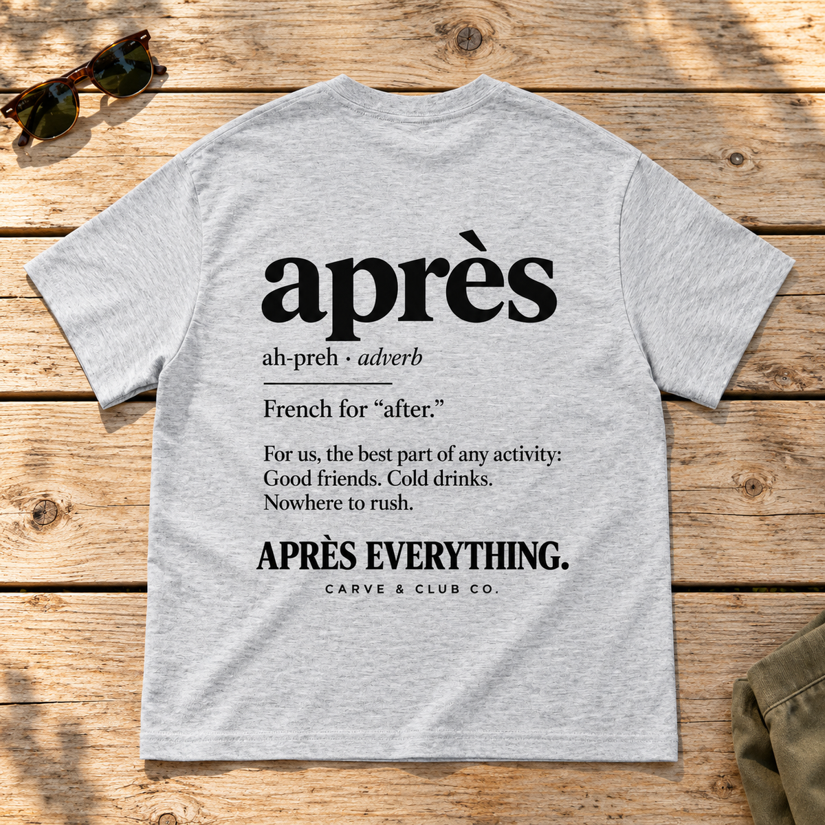 The Après Definition Tee — back view flat lay on wood tabletop