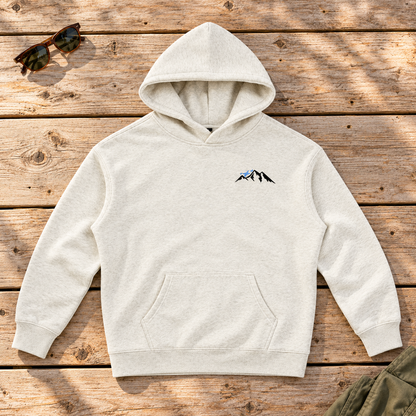 Last Lift Ticket Hoodie — front view flat lay on wood tabletop