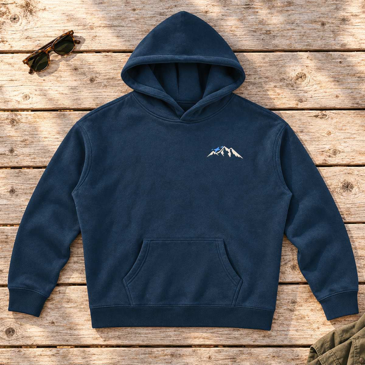 Last Lift Ticket Hoodie — front view flat lay on wood tabletop