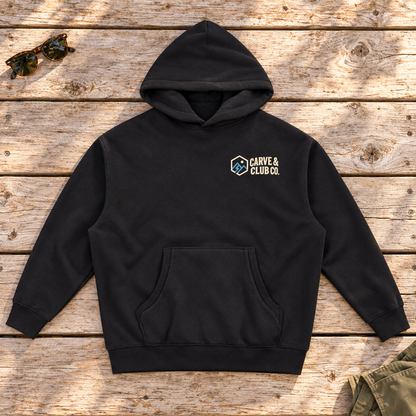 Aprés Department Hoodie — front view flat lay on wood tabletop