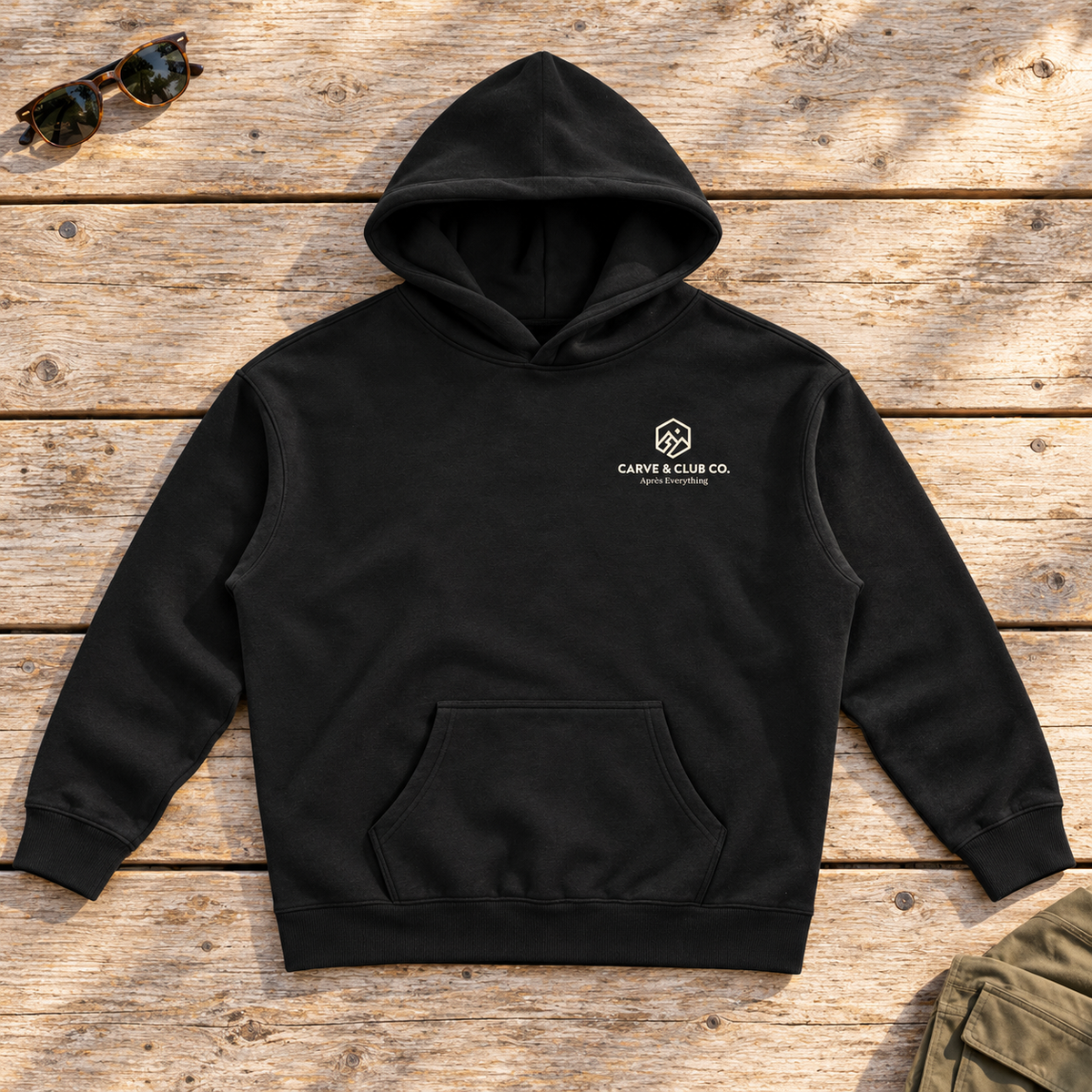 Après Everything Signature Hoodie — front view flat lay on wood tabletop