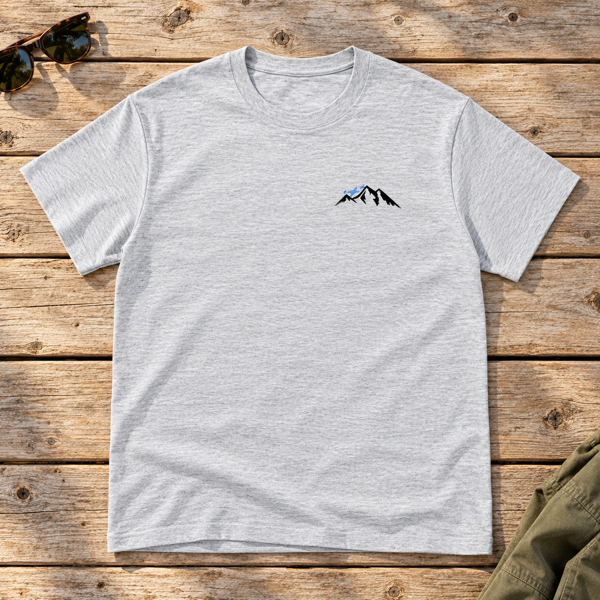 Last Lift Ticket Tee — front view flat lay on wood tabletop