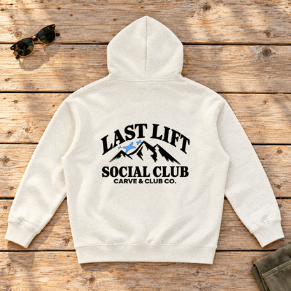 Last Lift Social Club Hoodie — back view flat lay on wood tabletop