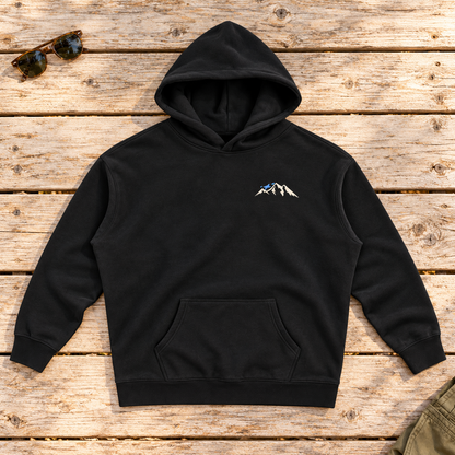 Last Lift Social Club Hoodie — front view flat lay on wood tabletop