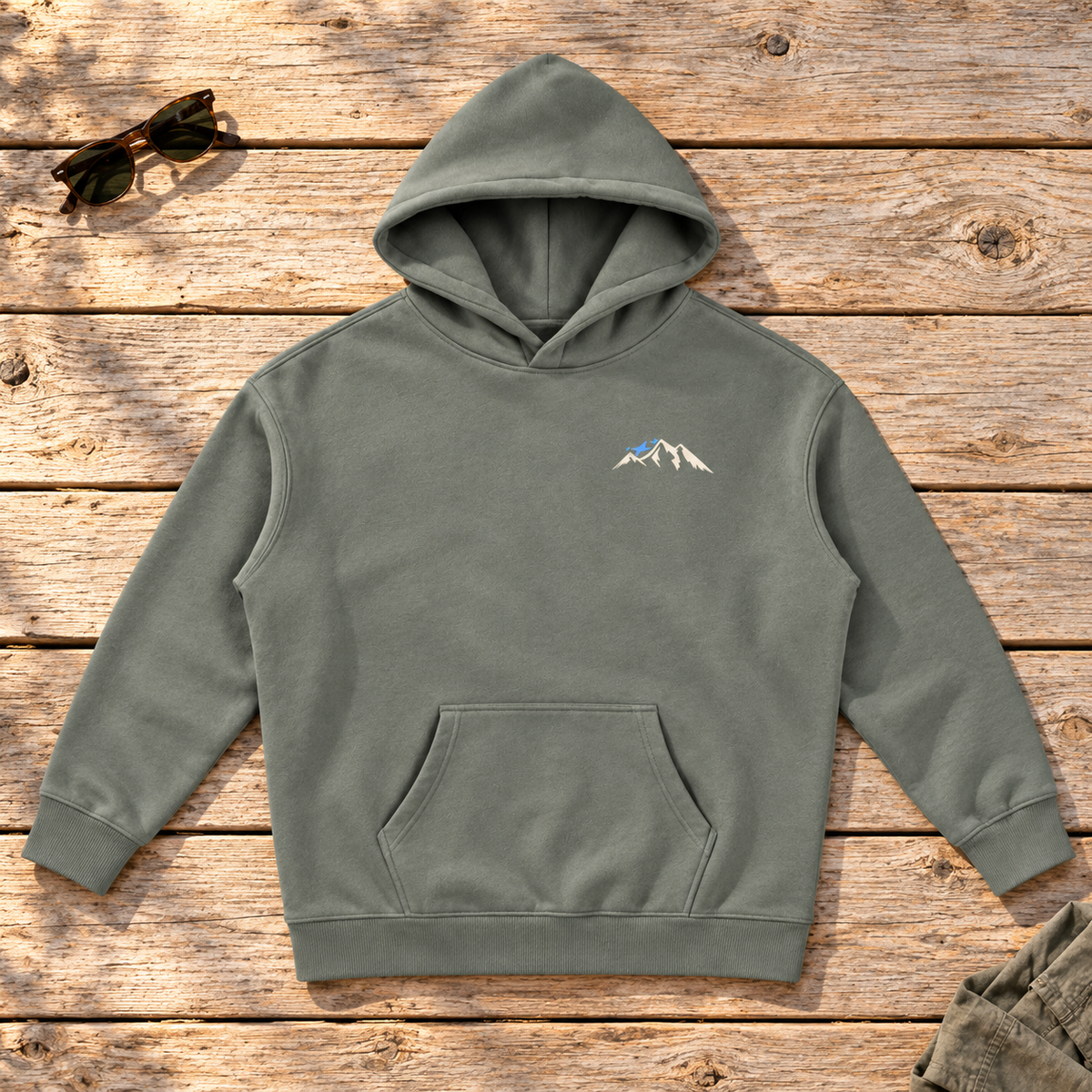 Last Lift Ticket Hoodie — front view flat lay on wood tabletop