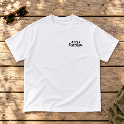 The Après Definition Tee — front view flat lay on wood tabletop