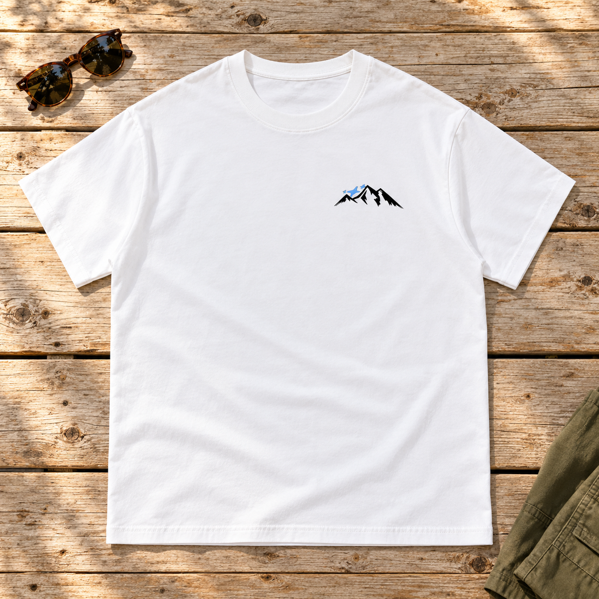 Last Lift Social Club Tee — front view flat lay on wood tabletop