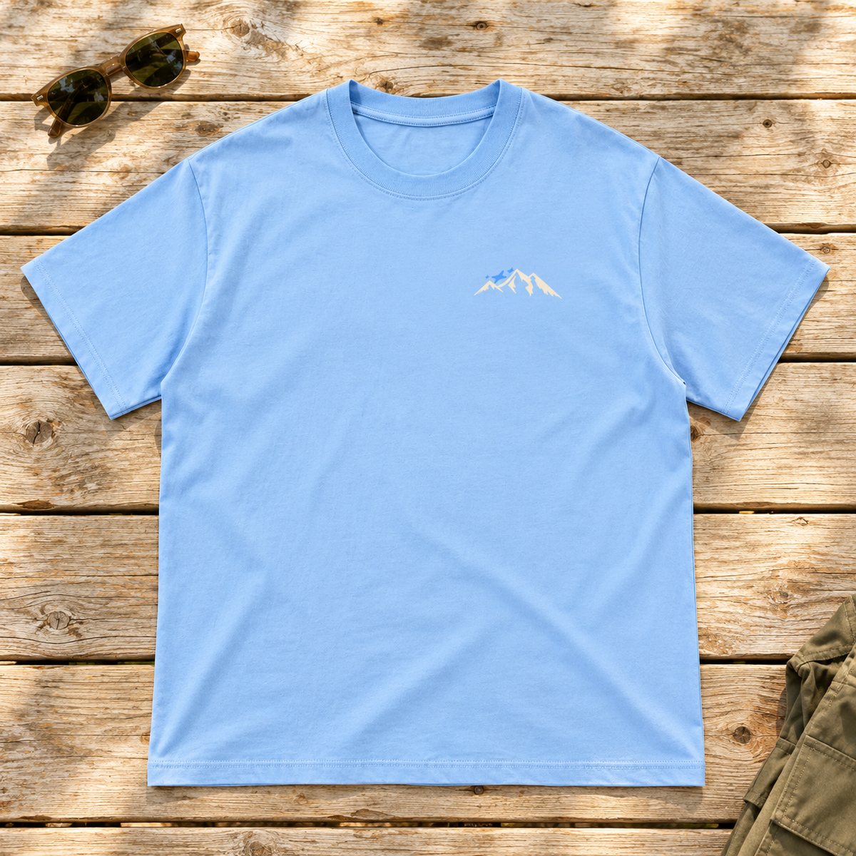Last Lift Social Club Tee — front view flat lay on wood tabletop
