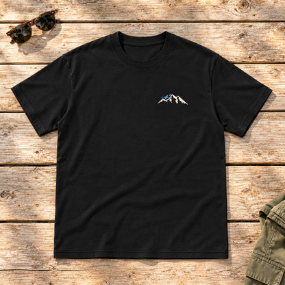 Last Lift Social Club Tee — front view flat lay on wood tabletop