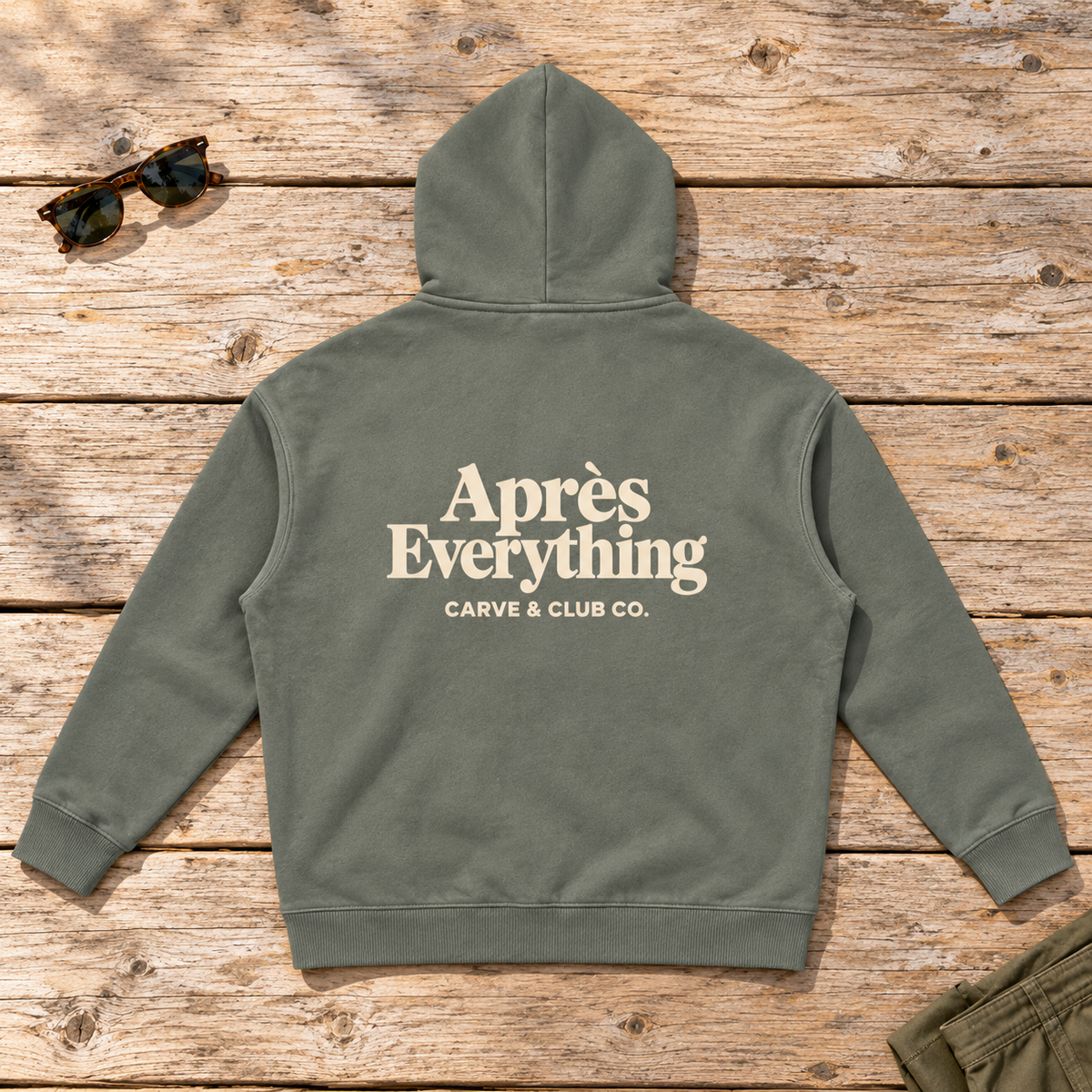 Après Everything Signature Hoodie — back view flat lay on wood tabletop