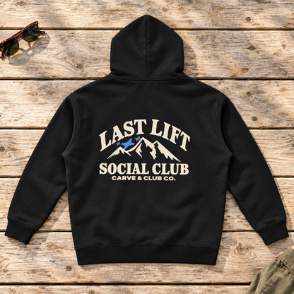 Last Lift Social Club Hoodie — back view flat lay on wood tabletop
