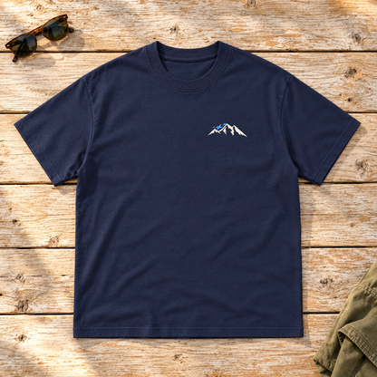Last Lift Ticket Tee — front view flat lay on wood tabletop