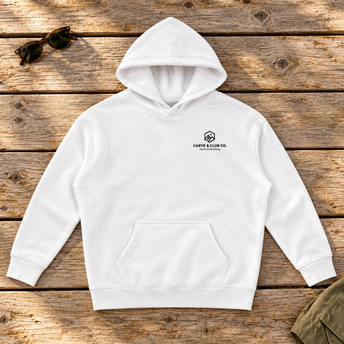 Après Everything Signature Hoodie — front view flat lay on wood tabletop