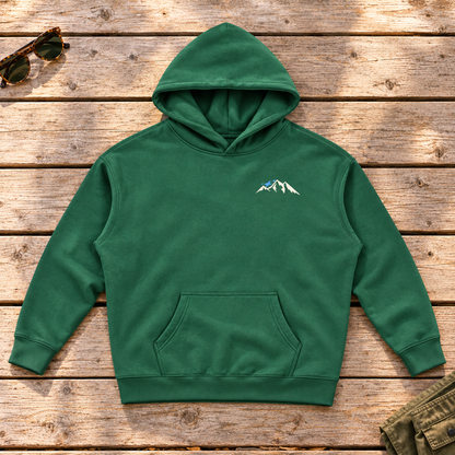 Last Lift Ticket Hoodie — front view flat lay on wood tabletop