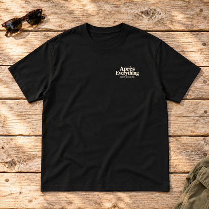 The Après Definition Tee — front view flat lay on wood tabletop