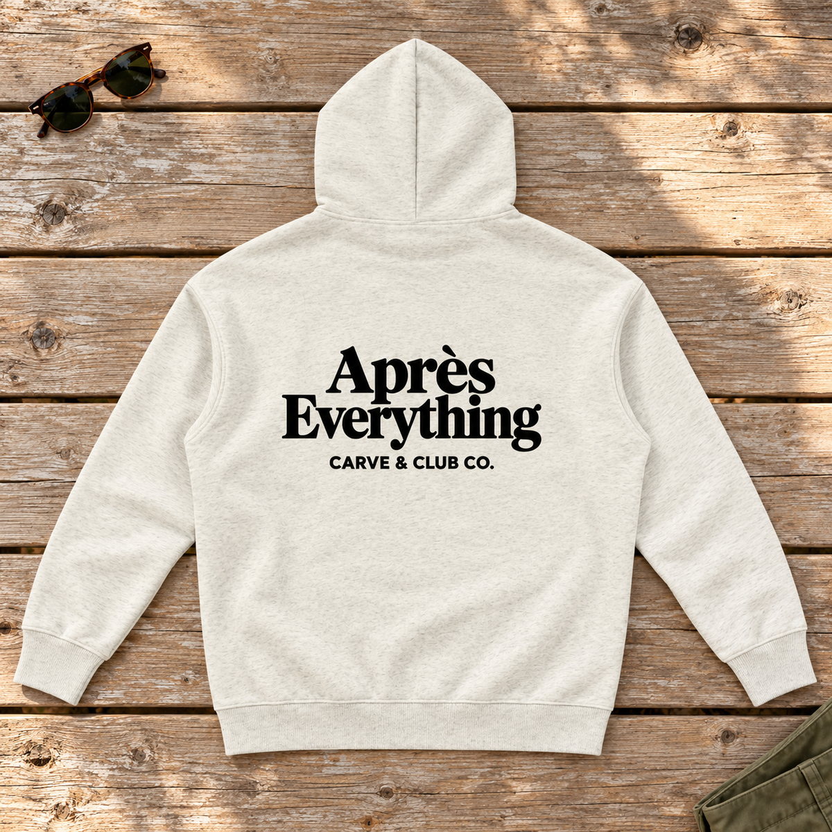 Après Everything Signature Hoodie — back view flat lay on wood tabletop