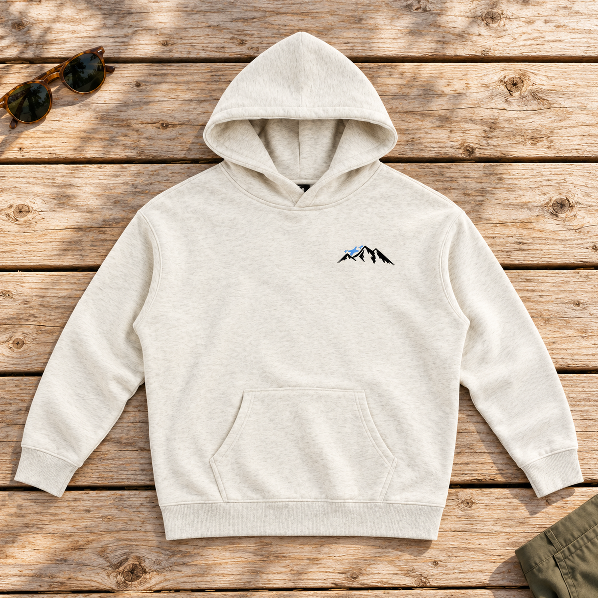 Last Lift Social Club Hoodie — front view flat lay on wood tabletop
