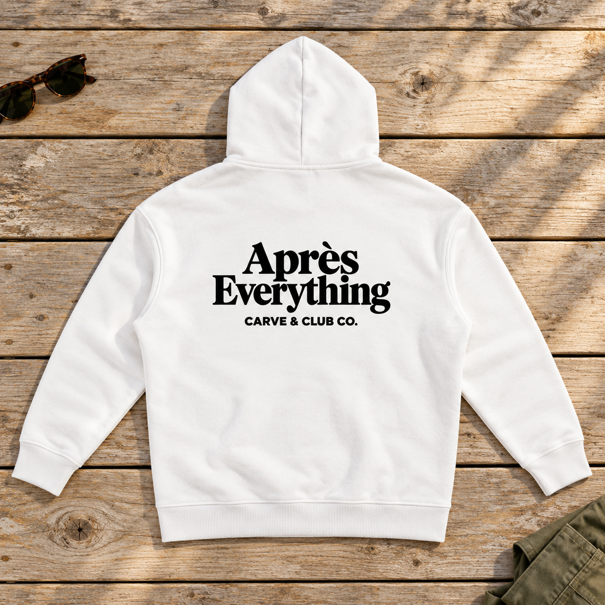 Après Everything Signature Hoodie — back view flat lay on wood tabletop