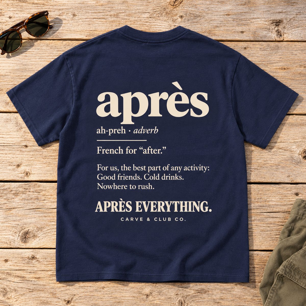 The Après Definition Tee — back view flat lay on wood tabletop
