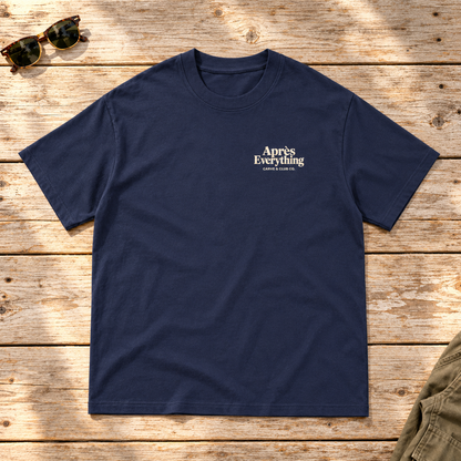 The Après Definition Tee — front view flat lay on wood tabletop